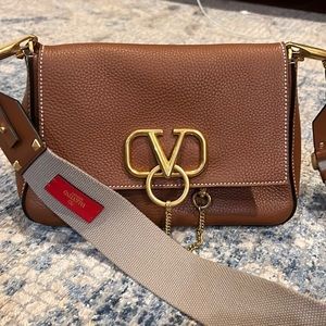 Authentic Valentino Garavani Pebbled Calfskin VRing Shoulder Bag Saddle Brown